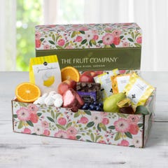 Flower themed mother's day gift box filled with an assortment of Pacific Northwest favorites from orchard fresh fruits, sweet delicacies, and calming teas.